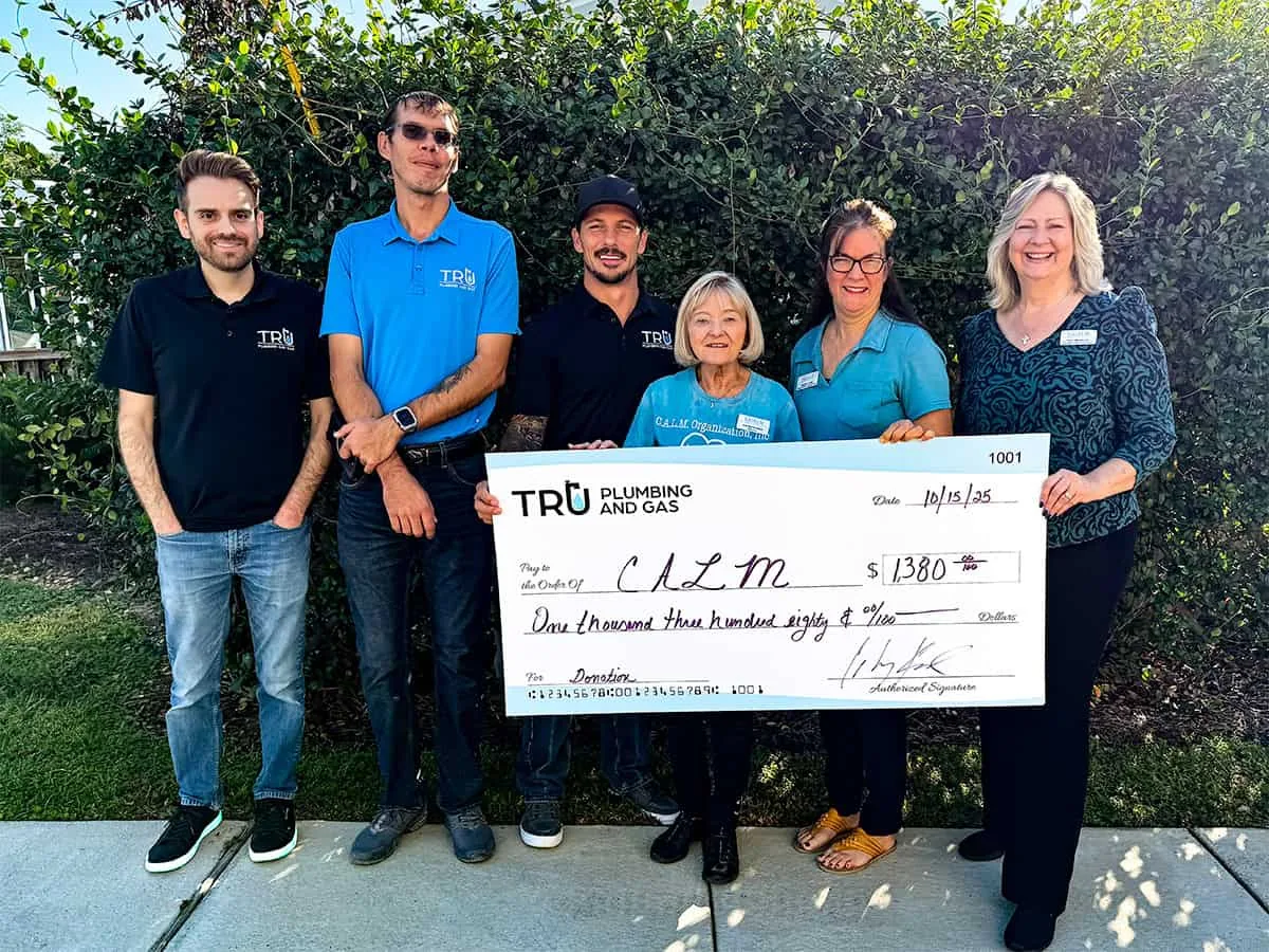Check presentation: Tru Plumbing and Gas donates $1,380 to CALM (Crisis Aid for Littles and Moms)
