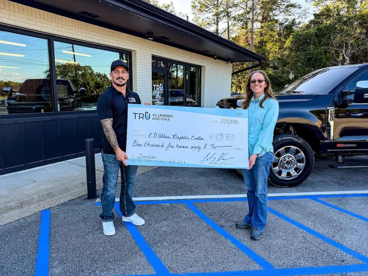 Check presentation: Tru Plumbing and Gas donates $1,580 to the E.O. Wilson Biophilia Center