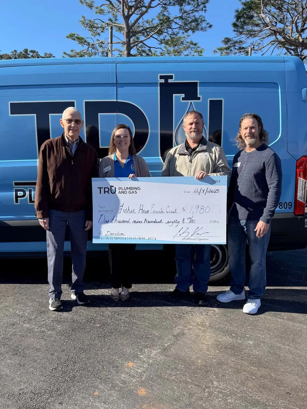 Check presentation: Tru Plumbing and Gas donates $1,980 to Fisher House of the Emerald Coast