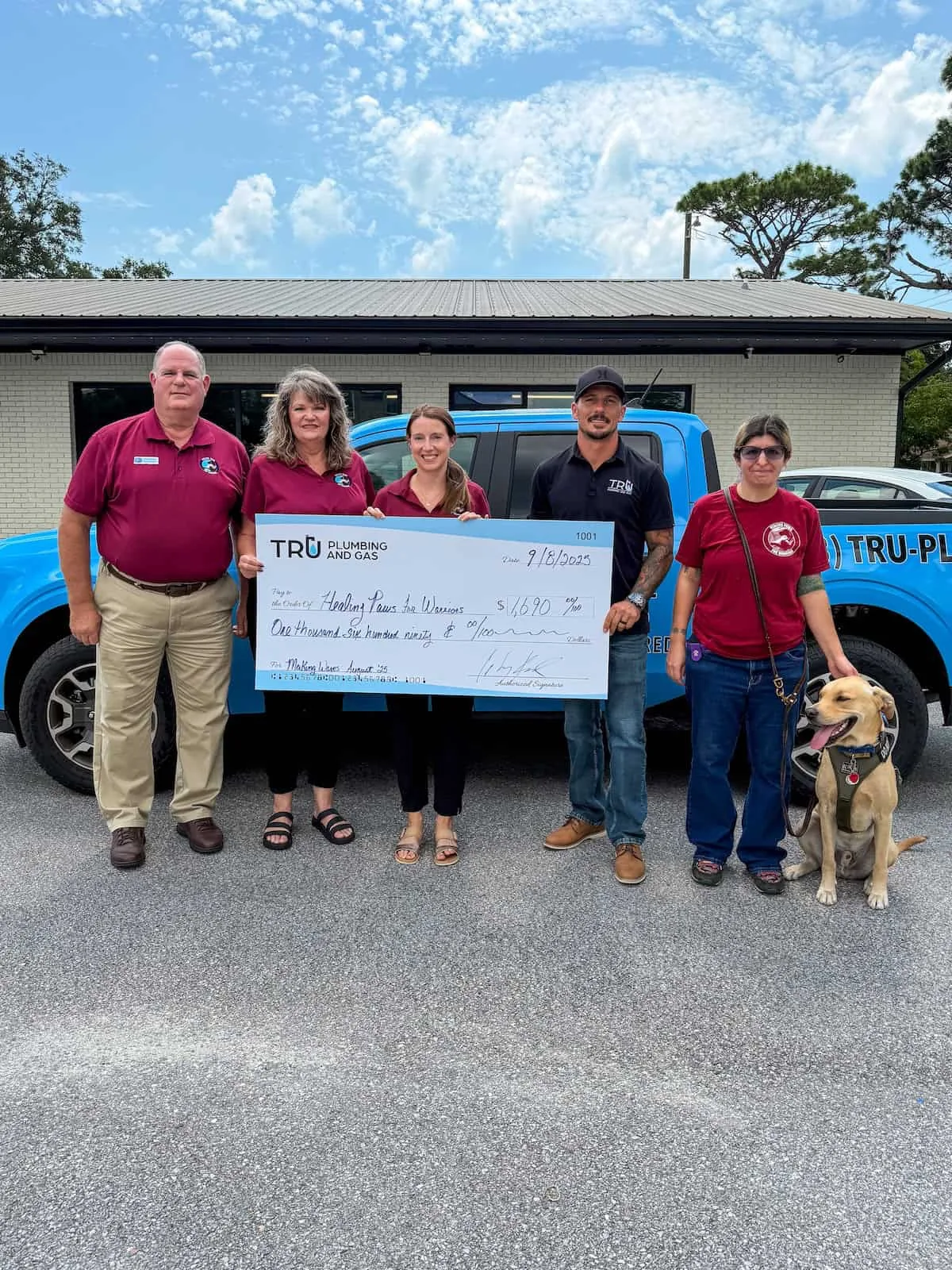 Check presentation: Tru Plumbing and Gas donates $1,690 to Healing Paws for Warriors