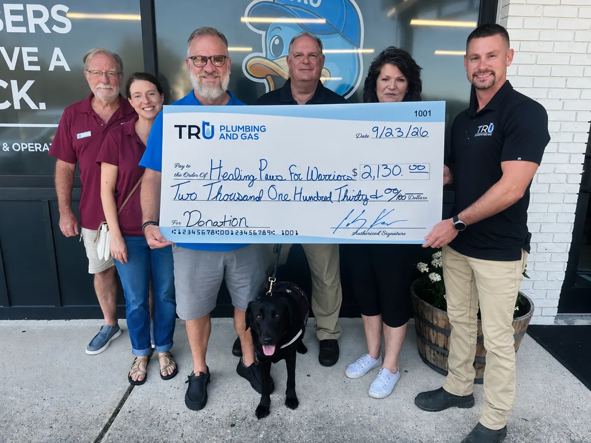 Check presentation: Tru Plumbing and Gas donates $2,130 to Healing Paws for Warriors
