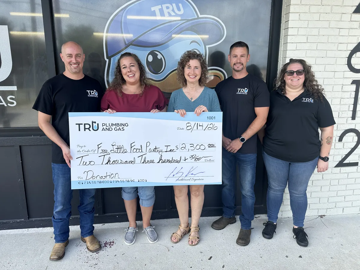 Check presentation: Tru Plumbing and Gas donates $2,300 to Free Little Food Pantry Inc.